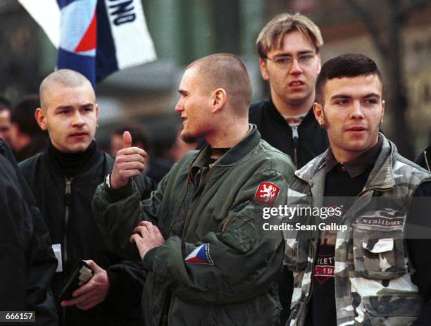 Czech skinheads attend a rally by the far-right Republican party in Prague March 13 held in commemoration of the 60th anniversary of the Nazi...