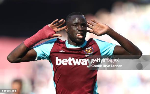 Cheikhou Kouyate of West Ham United celebrates scoring his sides first goal during the Premier League match between West Ham United and Swansea City...
