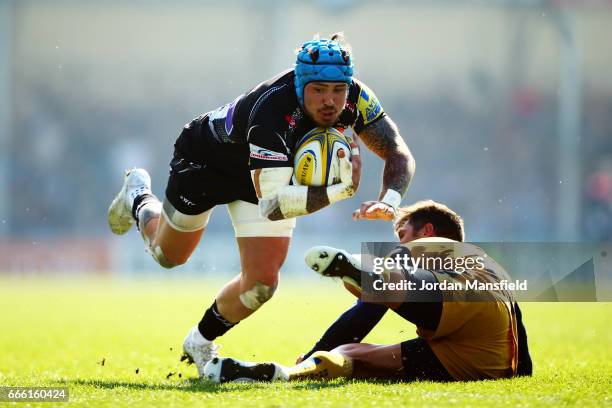 Jack Nowell of Exeter is tackled by Gavin Henson of Bristol during the Aviva Premiership match between Exeter Chiefs and Bristol Rugby at Sandy Park...