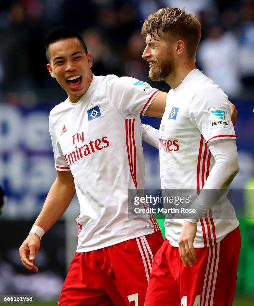 Aaron Hunt of Hamburg celebrate with his team mate Bobby Wood after scoring the 2nd goal during the Bundesliga match between Hamburger SV and TSG...