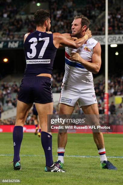 Michael Johnson of the Dockers wrestles with Travis Cloke of the Bulldogs during the round three AFL match between the Fremantle Dockers and the...