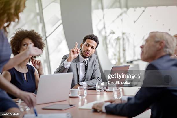 business people having meeting in modern in office - office politics stock pictures, royalty-free photos & images