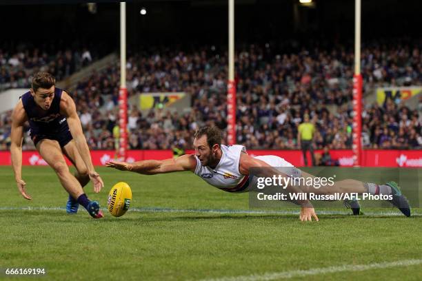 Lachie Weller of the Dockers and Travis Cloke of the Bulldogs go for the ball during the round three AFL match between the Fremantle Dockers and the...