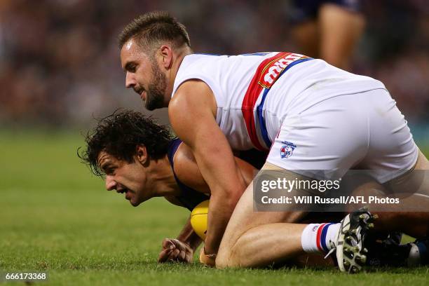 Brady Grey of the Dockers is tackled by Matt Suckling of the Bulldogs during the round three AFL match between the Fremantle Dockers and the Western...