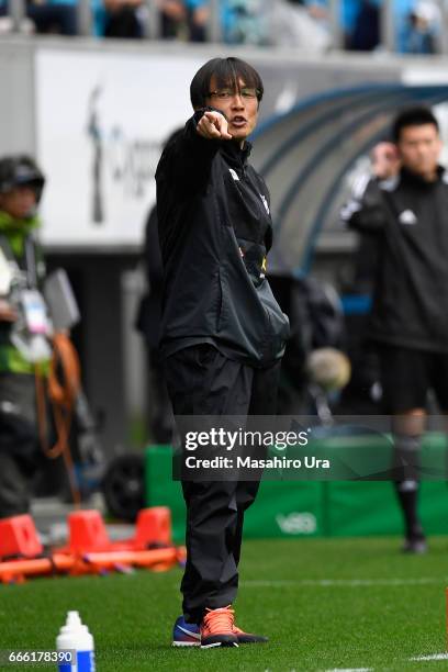 Head coach Fumitake Miura of Albirex Niigata gestures during the J.League J1 match between Sagan Tosu and Albirex Niigata at Best Amenity Stadium on...