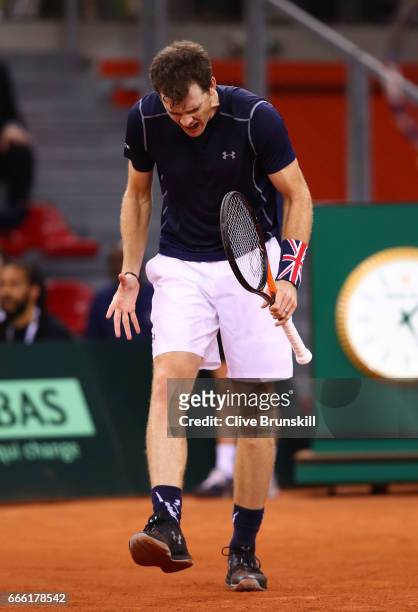Jamie Murray of Great Britain reacts partnering Dominic Inglot in the doubles match against Julien Benneteau and Nicolas Mahut of France during the...