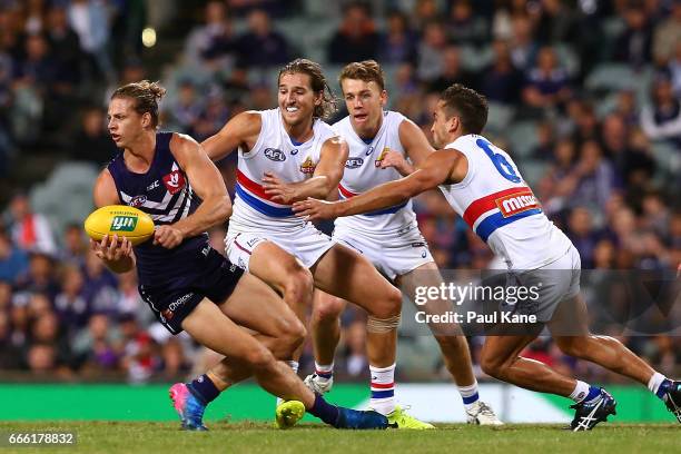 Nathan Fyfe of the Dockers looks to pass the ball during the round three AFL match between the Fremantle Dockers and the Western Bulldogs at Domain...