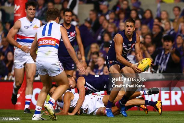 Stephen Hill of the Dockers looks to pass the ball during the round three AFL match between the Fremantle Dockers and the Western Bulldogs at Domain...