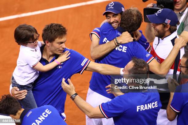 Nicolas Mahut and Julien Benneteau of France celebrate victory with team mates after the doubles match against Jamie Murray and Dominic Inglot of...