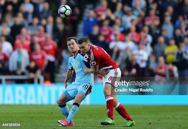 Ashley Barnes of Burnley and Ben Gibson of Middlesbrough battle for possession during the Premier League match between Middlesbrough and Burnley at...