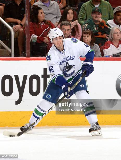 Jayson Megna of the Vancouver Canucks skates the puck up ice against the Arizona Coyotes at Gila River Arena on April 6, 2017 in Glendale, Arizona.