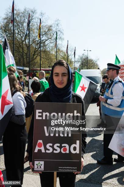 Hundreds of people take part in a protest against the use of chemical warfare in war-torn Syria in response to a recent chemical attack in Khan...