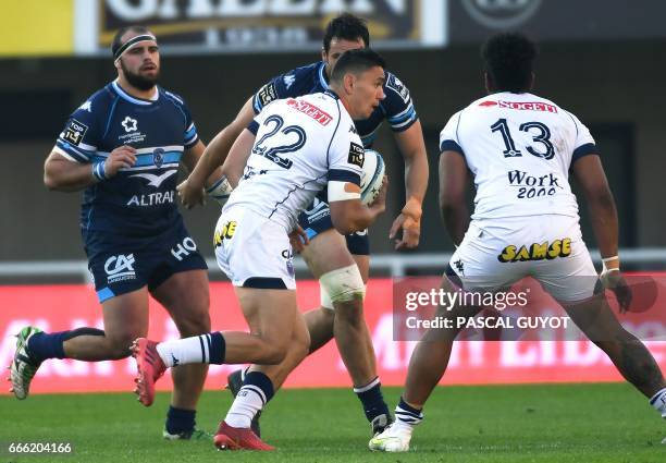 Grenoble's French centre Clement Gelin runs with the ball during the French Top 14 rugby union match between Montpellier and Grenoble at the Altrad...