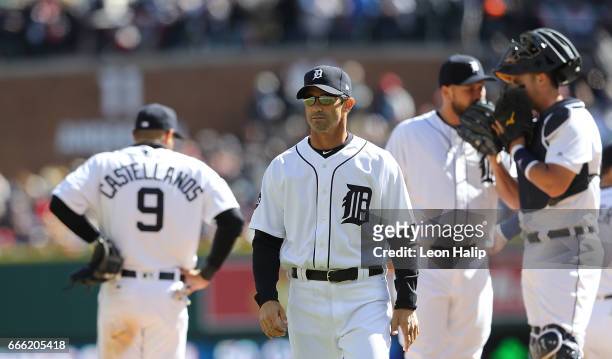 Manager Brad Ausmus of the Detroit Tigers walks back to the dugout after making a pitching change during the eight inning on opening day against the...