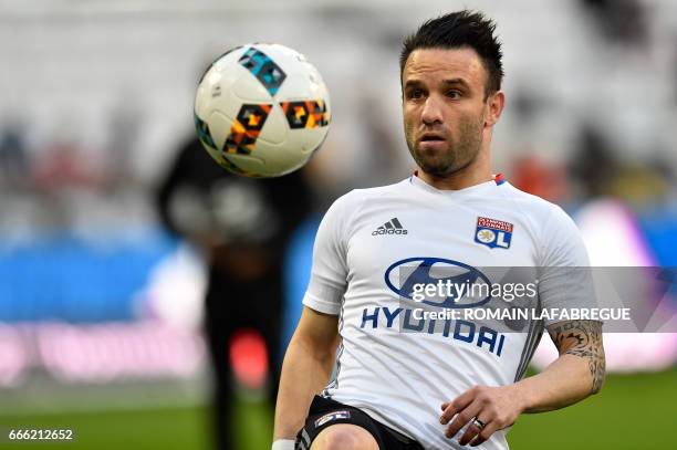 Lyon's French midfielder Mathieu Valbuena warms up prior to the French L1 football match between Olympique Lyonnais and Lorient on April 8 at the...