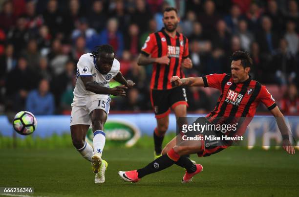 Victor Moses of Chelsea shoots as Charlie Daniels of AFC Bournemouth attempts to block during the Premier League match between AFC Bournemouth and...