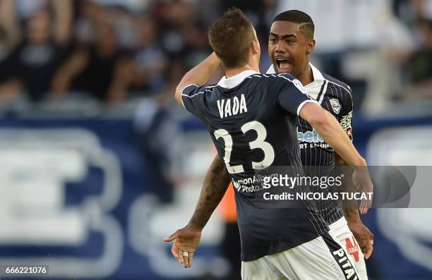 Bordeaux's Brazilian forward Malcom celebrates after scoring a goal during the French L1 football match between Bordeaux and Metz on April 8 at the...