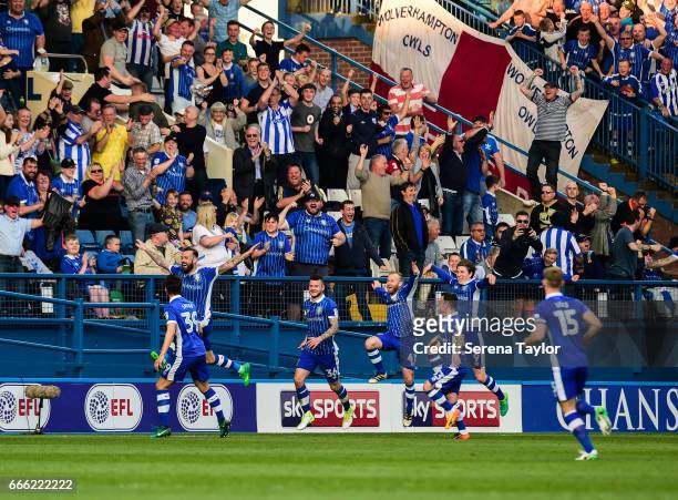Steven Fletcher of Sheffield Wednesday celebrates with teammates after scoring Sheffield's second goal during the Sky Bet Championship Match between...