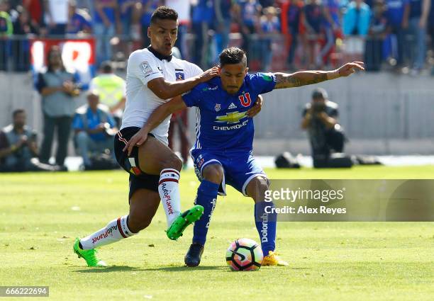 Sebastian Ubilla of U De Chile fights for the ball with Felipe Campos of Colo Colo during a match between U de Chile and Colo Colo as part of Torneo...