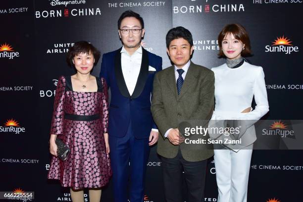 Guest, Lu Chuan, Guest and Hu Die attend Disneynature and The Cinema Society Host the Premiere of "Born in China" at the Landmark Sunshine Theater on...