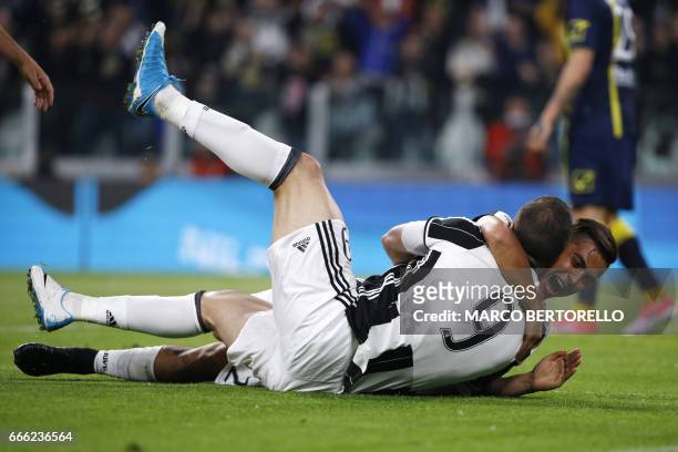 Juventus' forward Gonzalo Higuain from Argentina celebrates after scoring with his teammate Juventus' forward Paulo Dybala from Argentina during the...
