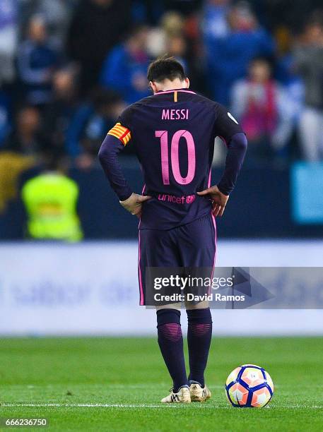 Lionel Messi of FC Barcelona reacts dejected after Sandro Ramirez of Malaga CF scored the opening goal during the La Liga match between Malaga CF and...