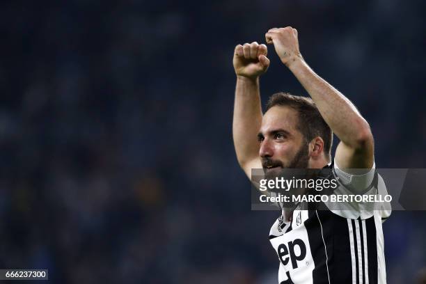 Juventus' forward Gonzalo Higuain from Argentina celebrates after scoring during the Italian Serie A football match Juventus vs Chievo on April 8,...