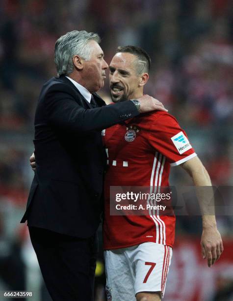 Franck Ribery of Bayern Muenchen is congratulated by Carlo Ancelotti head coach of Bayern Muenchen after being substituted during the Bundesliga...