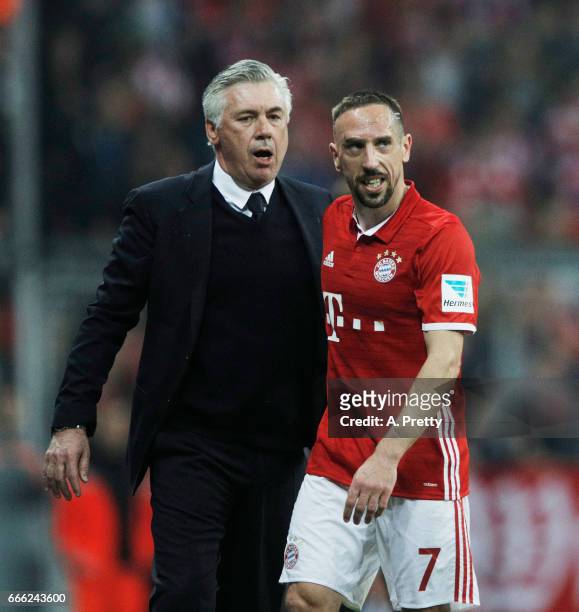 Franck Ribery of Bayern Muenchen is congratulated by Carlo Ancelotti head coach of Bayern Muenchen after being substituted during the Bundesliga...
