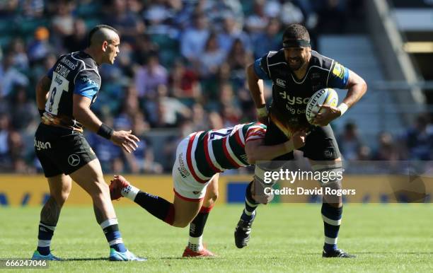 Toby Faletau of Bath is tackled during the Aviva Premiership match between Bath and Leicester Tigers at Twickenham Stadium on April 8, 2017 in...