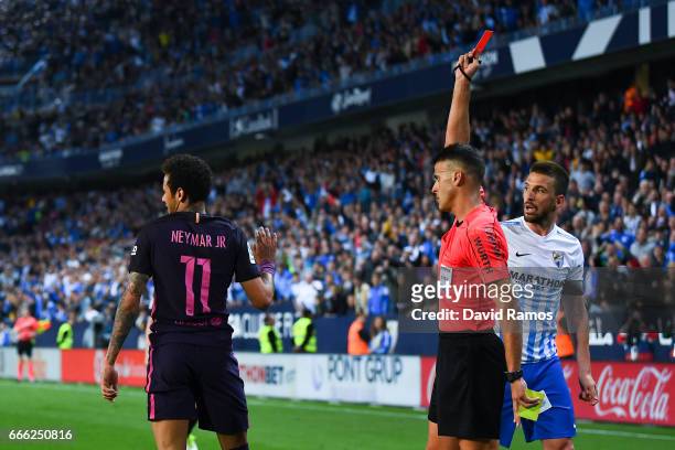 Neymar Jr. Of FC Barcelona is shown a red card during the La Liga match between Malaga CF and FC Barcelona at La Rosaleda stadium on April 8, 2017 in...