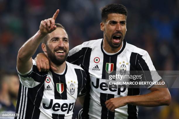 Juventus' forward Gonzalo Higuain from Argentina celebrates after scoring with his teammate Juventus' midfielder Sami Khedira from Germany during the...