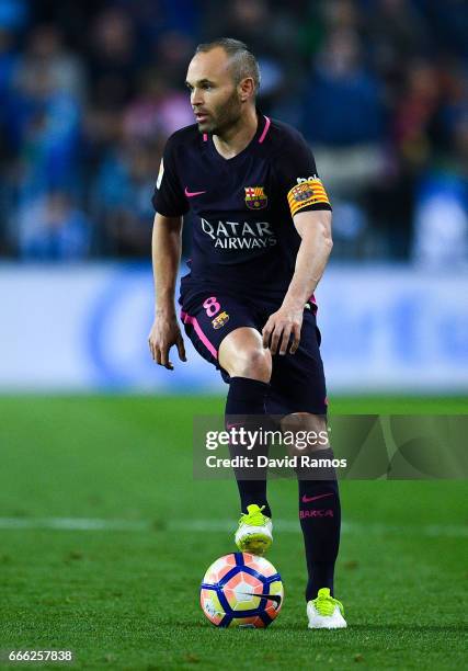 Andres Iniesta of FC Barcelona runs with the ball during the La Liga match between Malaga CF and FC Barcelona at La Rosaleda stadium on April 8, 2017...