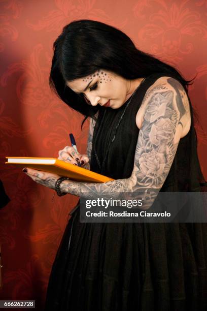 Kat Von D signs a book as she meets her fans at at Sephora, C.so Vittorio Emanuele Milan on April 8, 2017 in Milan, Italy.