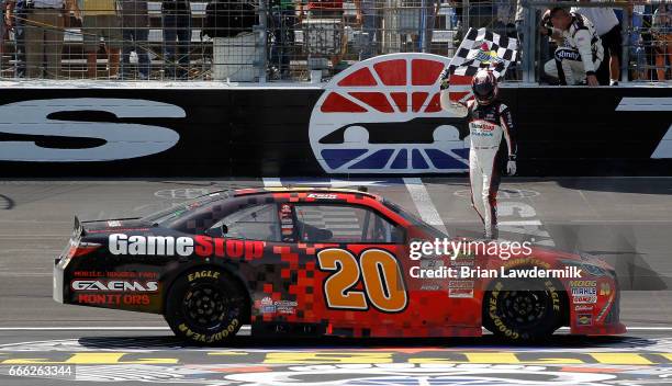 Erik Jones, driver of the GameStop/GAEMS Toyota, celebrates winning the NASCAR XFINITY Series My Bariatric Solutions 300 at Texas Motor Speedway on...