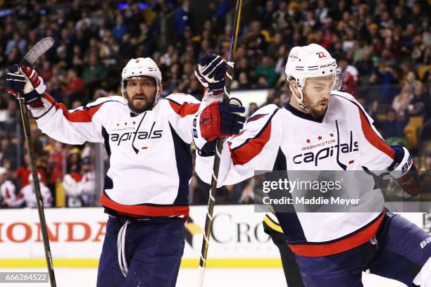 Kevin Shattenkirk of the Washington Capitals celebrates with Alex Ovechkin after scoring against the Boston Bruins during the second period at TD...