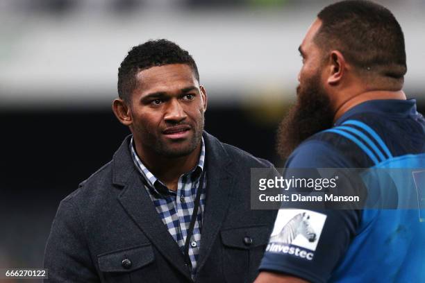 Waisake Naholo of the Highlanders and Charlie Faumuina catch up after the round seven Super Rugby match between the Highlanders and the Blues on...