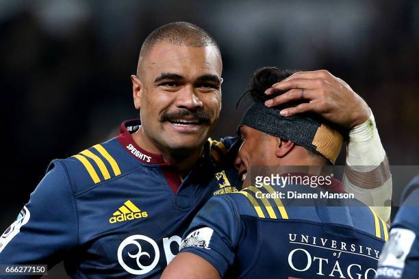 Patrick Osborne of the HIghlanders celebrates Malakai Fekitoa's try during the round seven Super Rugby match between the Highlanders and the Blues on...