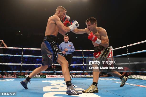 Terry Flanagan exchanges blows with Petr Petrov during their WBO World Lightweight Championship fight at Manchester Arena on April 8, 2017 in...