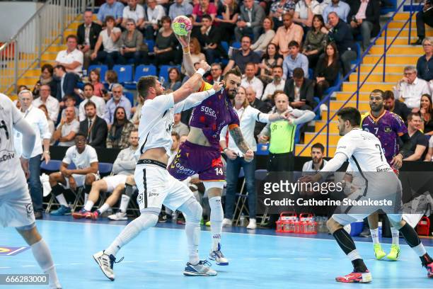 Theo Derot of HBC Nantes is shooting the ball against Luka Karabatic of Paris Saint Germain during the final match of the Coupe de la Ligue between...