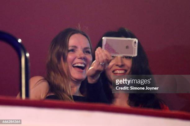 Geri Horner takes a photo on her smartphone as she watches Melanie C with Sally Wood at O2 Shepherd's Bush Empire on April 8, 2017 in London, England.