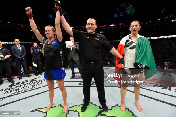 Katlyn Chookagian is awarded victory by split decision over Irene Aldana of Mexico in their women's bantamweight bout during the UFC 210 event at...