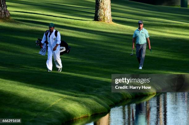 Charley Hoffman of the United States and Brett Waldman walk to the 16th green during the third round of the 2017 Masters Tournament at Augusta...