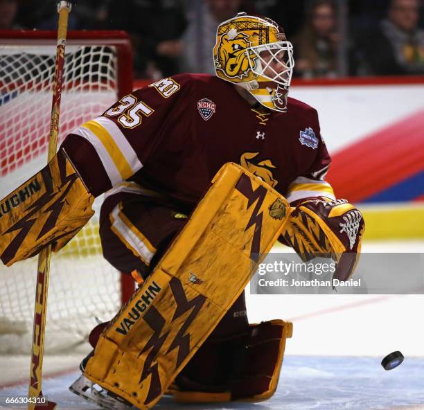Hunter Miska of the Minnesota-Duluth Bulldogs makes a save against the Denver Pioneers during the 2017 NCAA Division I Men's Ice Hockey Championship...