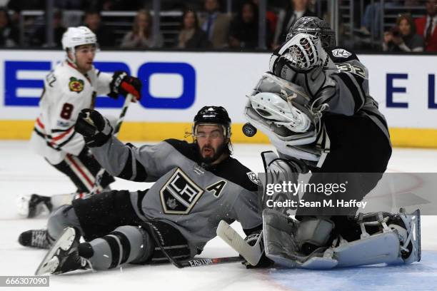 Drew Doughty collides with Jonathan Quick of the Los Angeles Kings on a shot on goal during the third period of a game against the Los Angeles Kings...