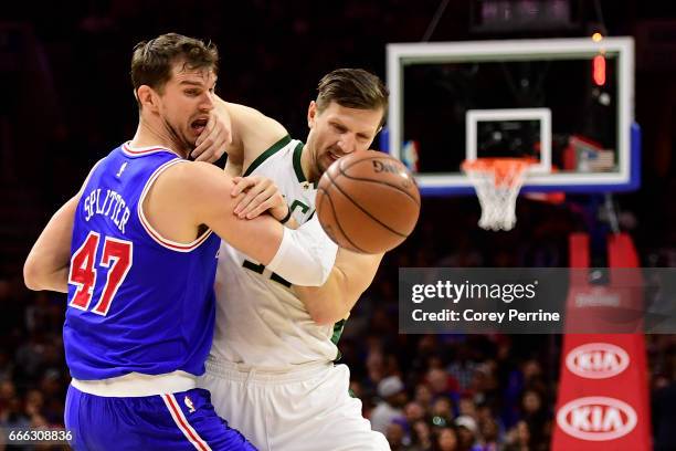 Mirza Teletovic of the Milwaukee Bucks pushes on Tiago Splitter of the Philadelphia 76ers during the fourth quarter at the Wells Fargo Center on...