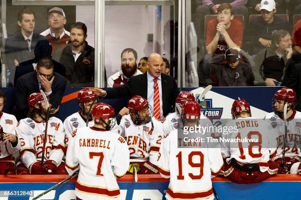 Jim Montgomery head coach of the Denver Pioneers talks behind the bench during the 2017 NCAA Photos via Getty Images Div I Men's Ice Hockey...