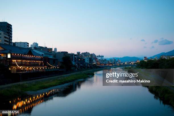 summer evening view of kamo river, kyoto city - kamo river stock pictures, royalty-free photos & images