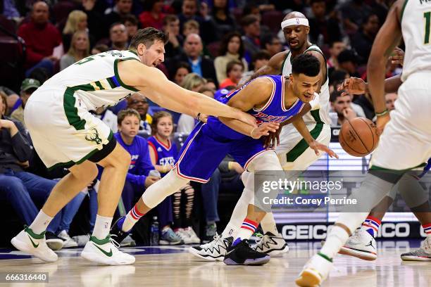 Mirza Teletovic of the Milwaukee Bucks reaches in on Timothe Luwawu-Cabarrot of the Philadelphia 76ers during the first quarter at the Wells Fargo...