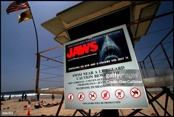 Poster advertising the anniversary collector's edition of the movie "Jaws" is posted on a lifeguard tower June 2, 2000 on Zuma Beach in Malibu, CA....